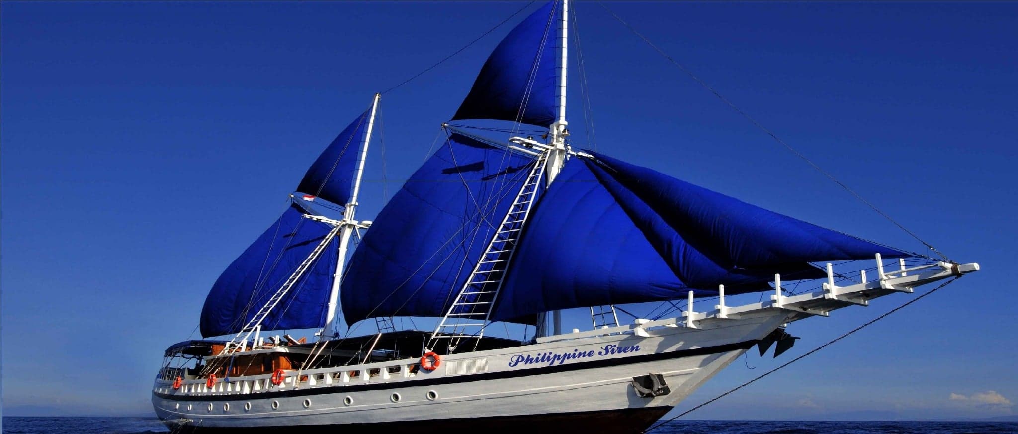 Philippine Siren sails between the Visayas and Tubbataha, with diving that blends macro marvels, reef sharks, and current-swept coral slopes