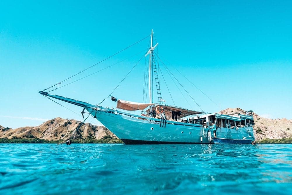 Bajak liveaboard focuses on Komodo National Park, diving sites like Batu Bolong and Manta Point, where rich marine biodiversity includes manta rays and reef sharks