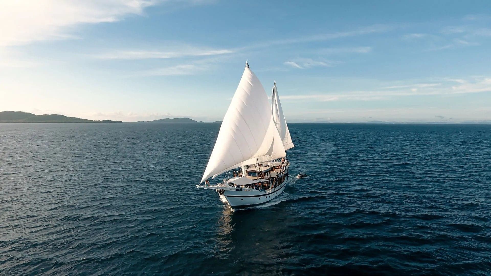 Teman offers intimate diving cruises across Komodo and Raja Ampat. This phinisi-style yacht blends comfort with exploration, making every journey feel unique