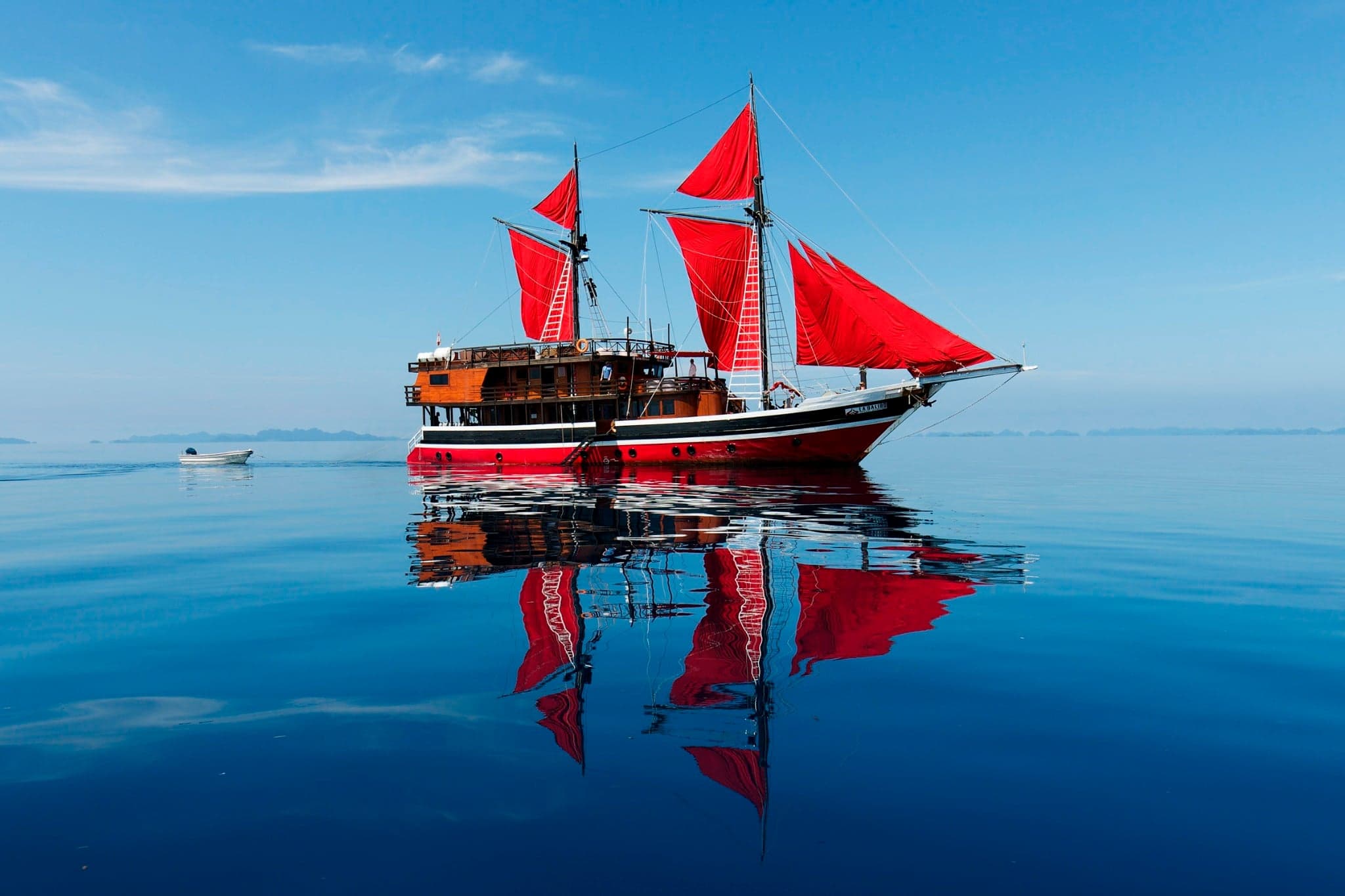 La Galigo blends modern dive operations with traditional phinisi style. Itineraries span Raja Ampat and Komodo, delivering manta rays, reef sharks, and vivid coral reefs