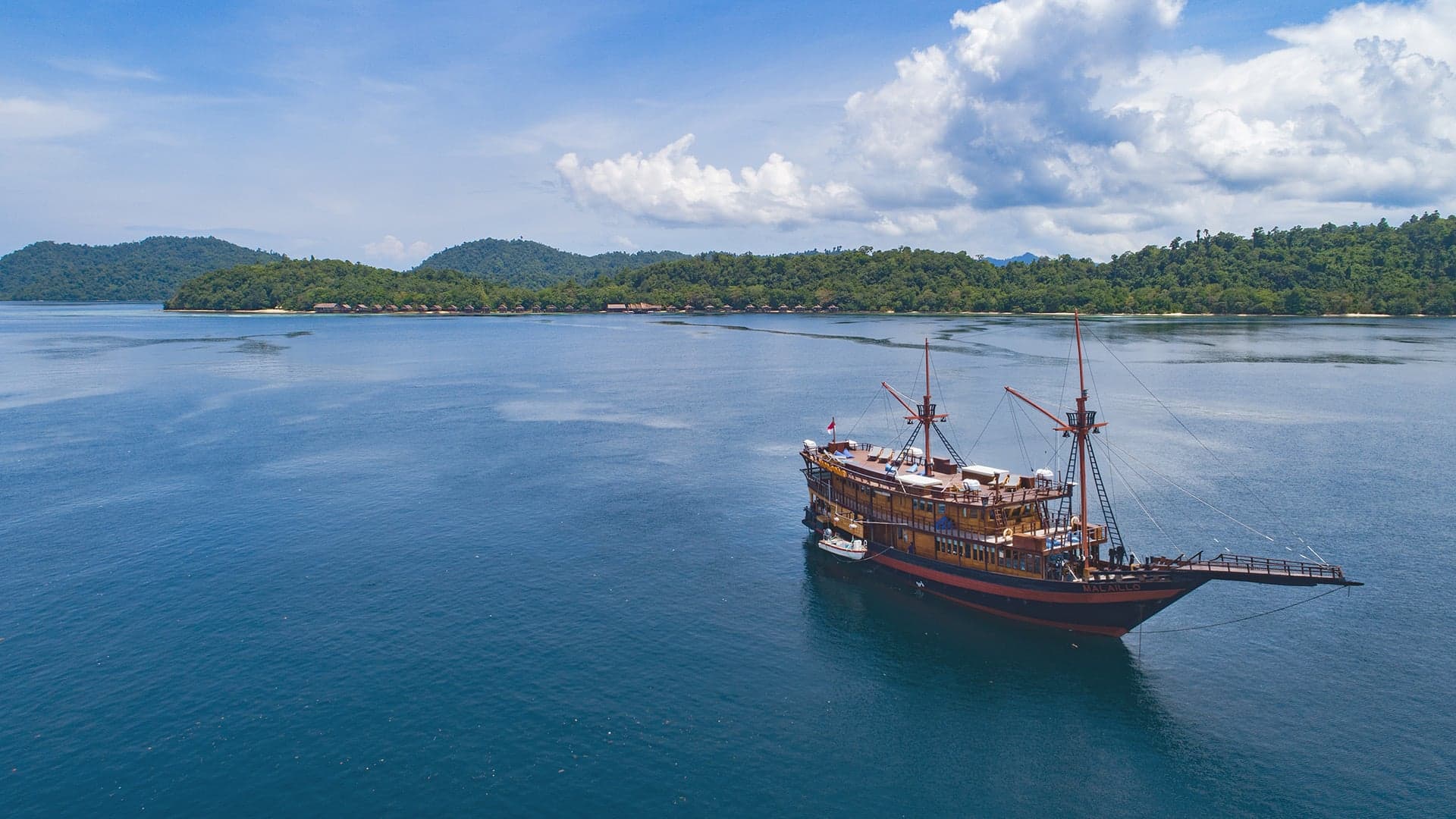 Malaillo liveaboard explores Raja Ampat, Komodo, Alor, and Banda Sea, offering free nitrox, a dedicated camera room, and spacious dive deck. Accommodates 14 guests in en-suite cabins