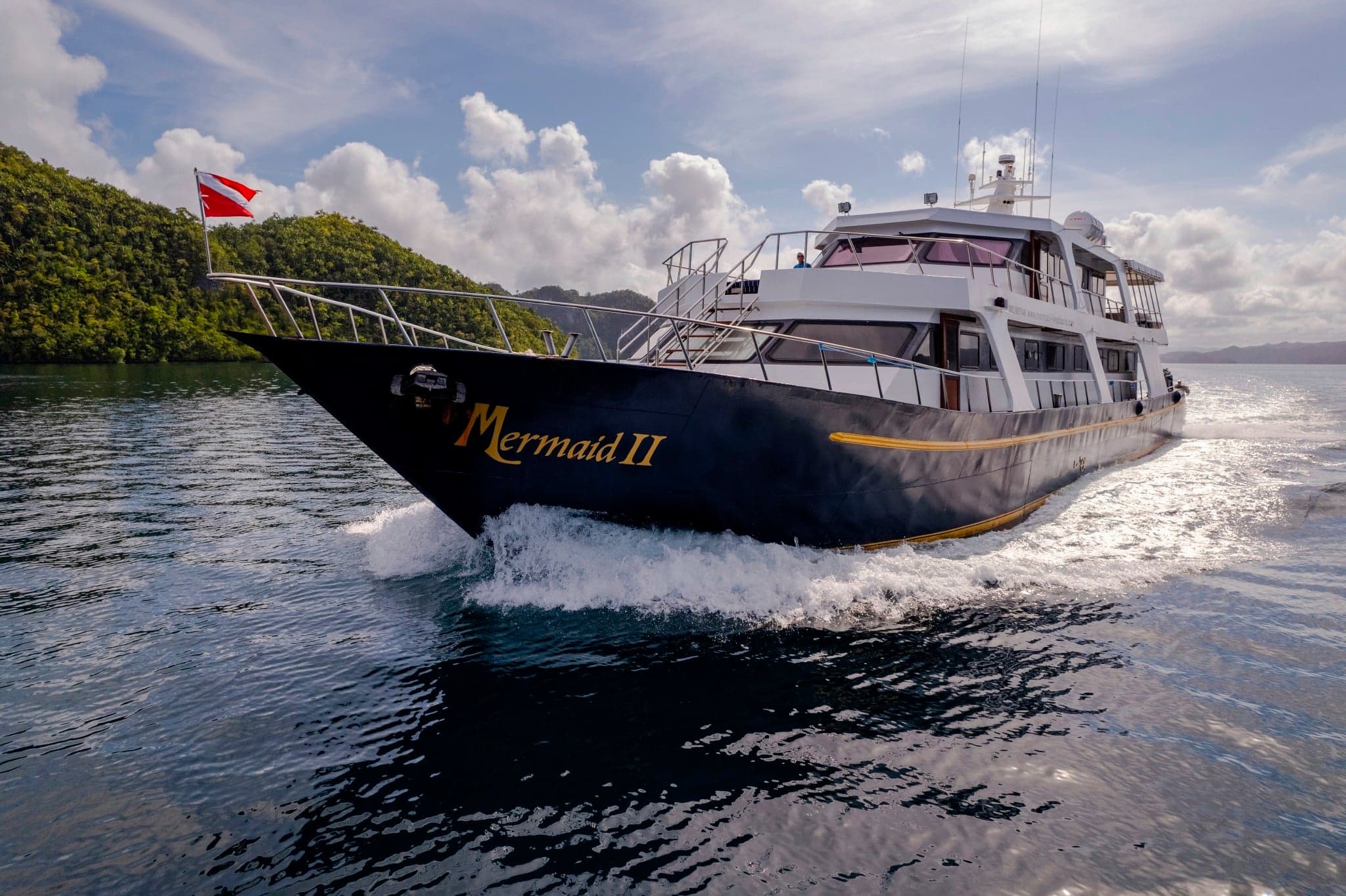 Mermaid II offers reliable comfort on Indonesian routes through Komodo and Raja Ampat, where divers encounter manta rays, turtles, and swarms of reef fish in crystal-clear waters