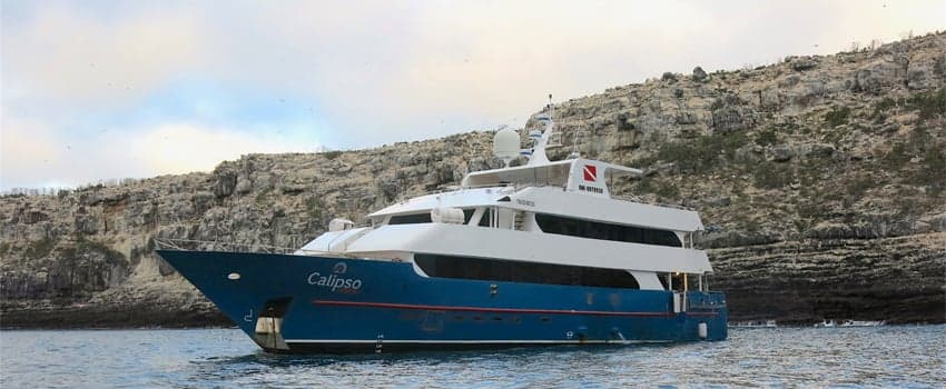 Calipso liveaboard cruises the Galapagos Islands, diving at renowned sites like Darwin and Wolf Islands, where divers can encounter hammerhead sharks, marine iguanas, and manta rays