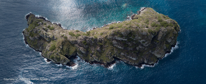 Aerial perspective of Manuelita Island, a volcanic peak near Cocos Island.
