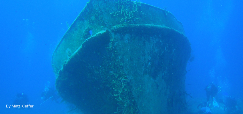 The shipwreck of the Austin Smith sitting upright on the sandy seabed in the Exuma Cays, Bahamas. 