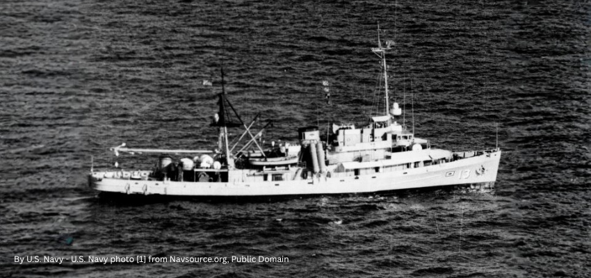 The U.S. Navy submarine rescue ship USS Kittiwake (ASR-13) underway, in the 1970s, before the addition of the QE-82 satellite antenna.