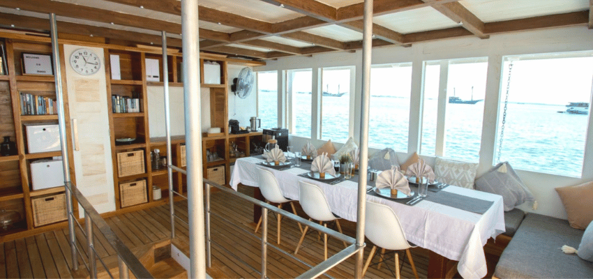 dining Fenides Liveaboard Indonesia High-spec climate-controlled camera workspace and gear prep area on the Fenides luxury dive boat.
