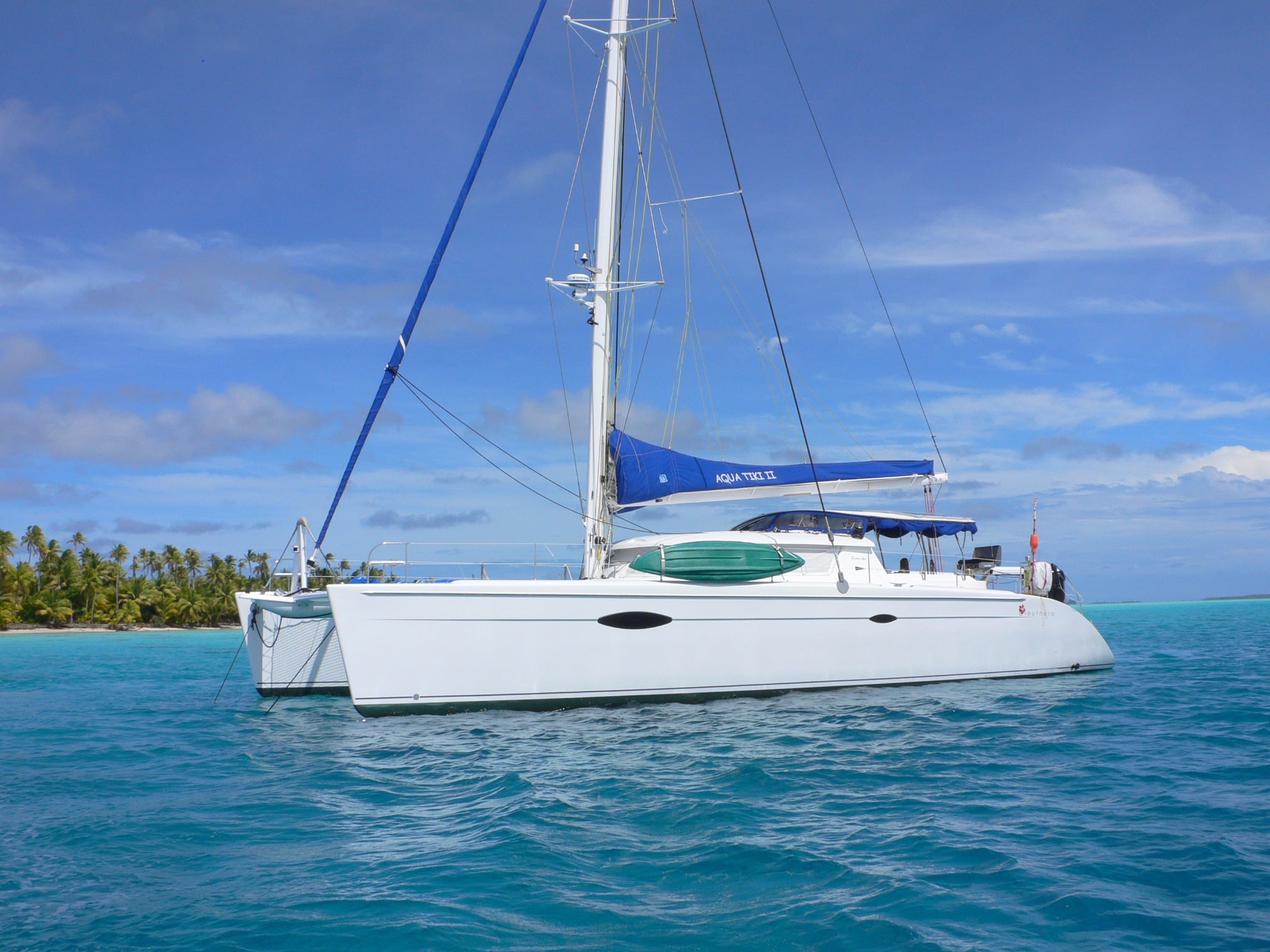 Aquatiki II catamaran explores the Tuamotu Archipelago’s top dive sites, with Rangiroa and Fakarava offering sharks, dolphins, and sprawling coral gardens