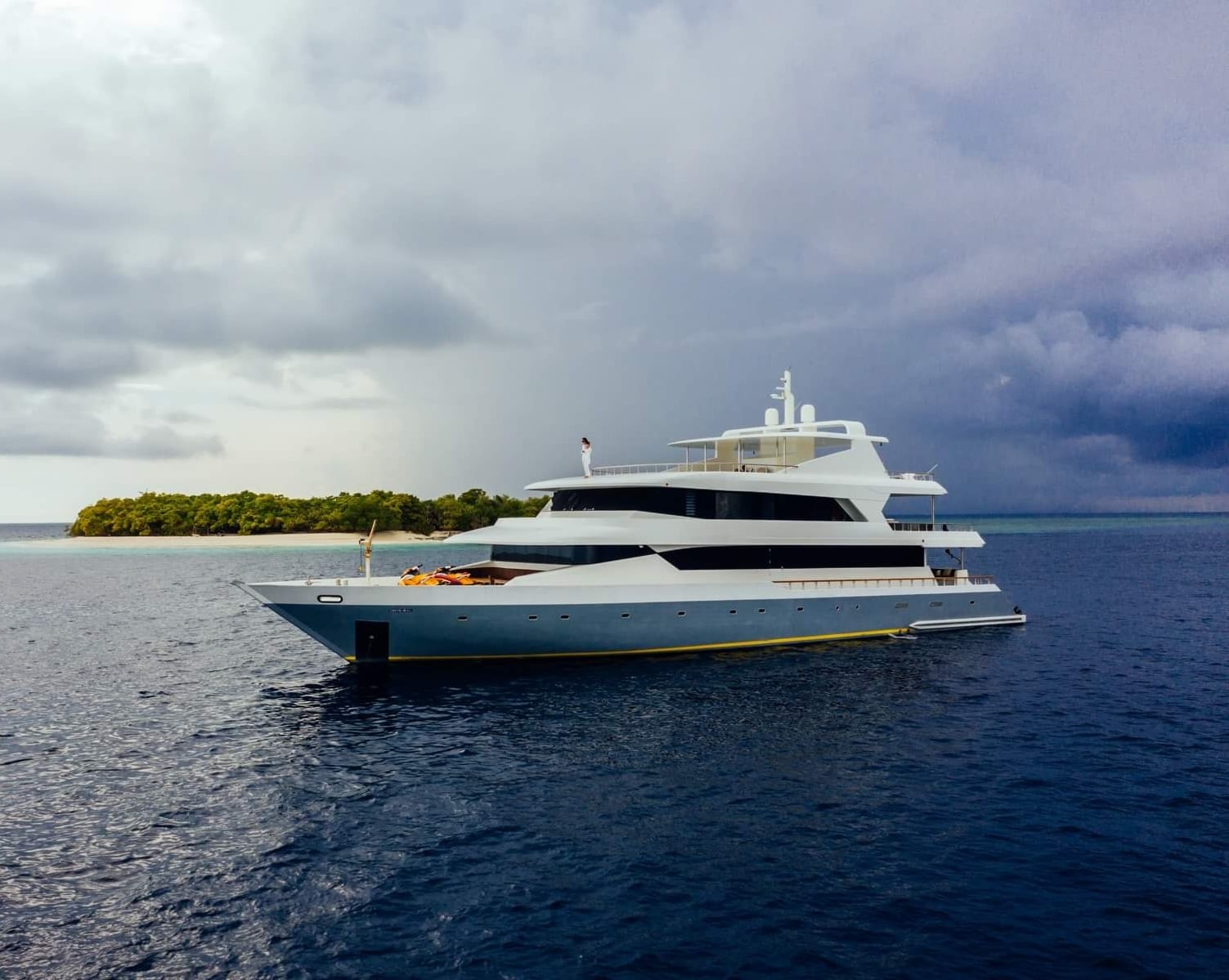 Princess Ulua liveaboard navigates the Maldives' atolls, diving at sites like Maaya Thila and Fish Head, where encounters with grey reef sharks, manta rays, and vibrant coral formations are common