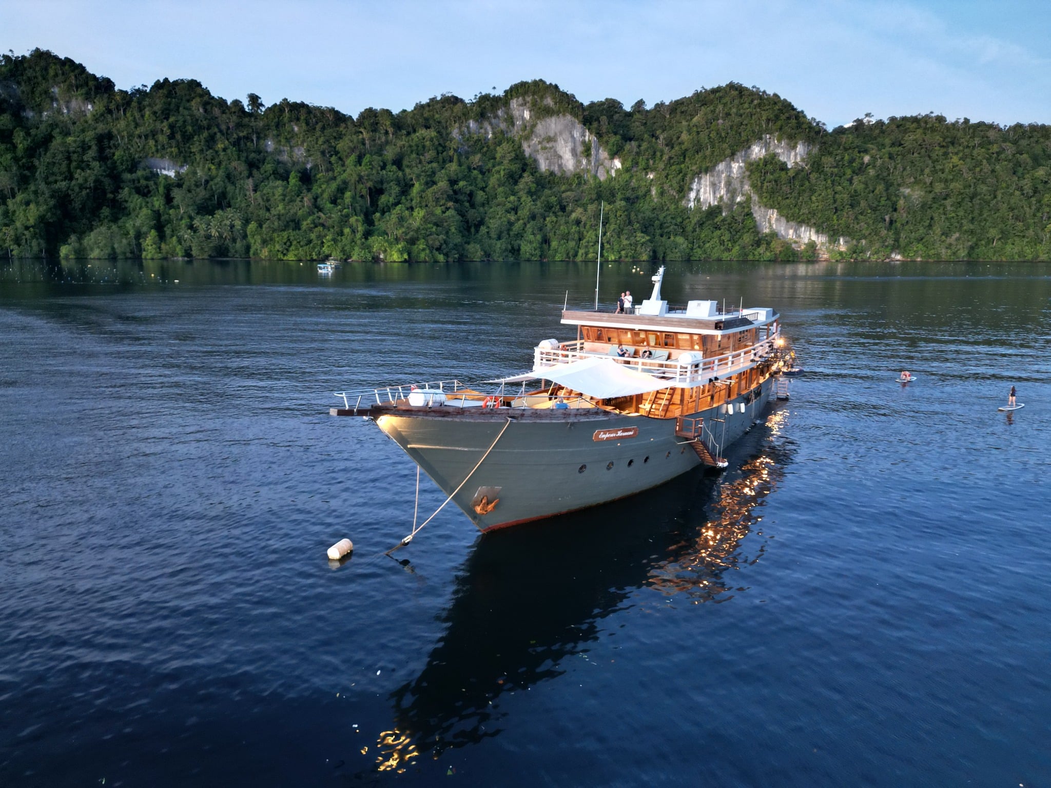 Emperor Harmoni, a 48-meter vessel, offers voyages through Komodo, Raja Ampat, and the Banda Sea, providing divers with opportunities to explore diverse marine ecosystems and encounter species like manta rays and reef sharks