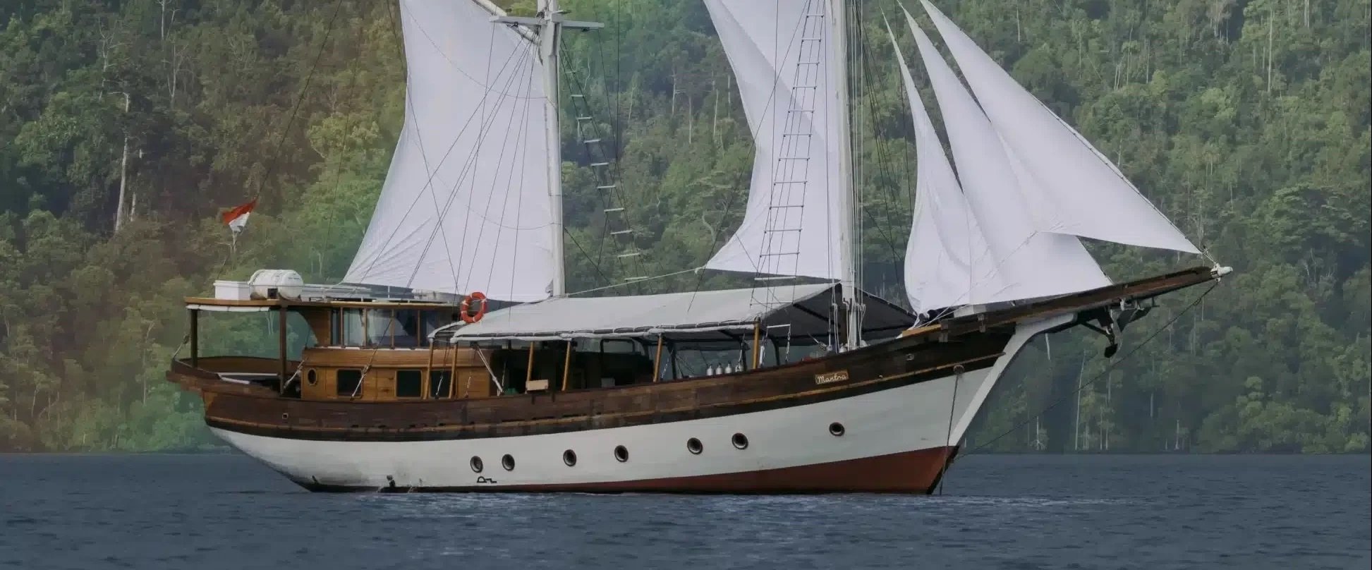 Anne Bonny Yacht liveaboard explores Komodo and Raja Ampat. Encounter manta rays, reef sharks, and macro life while sailing on a traditionally designed vessel with modern comforts.