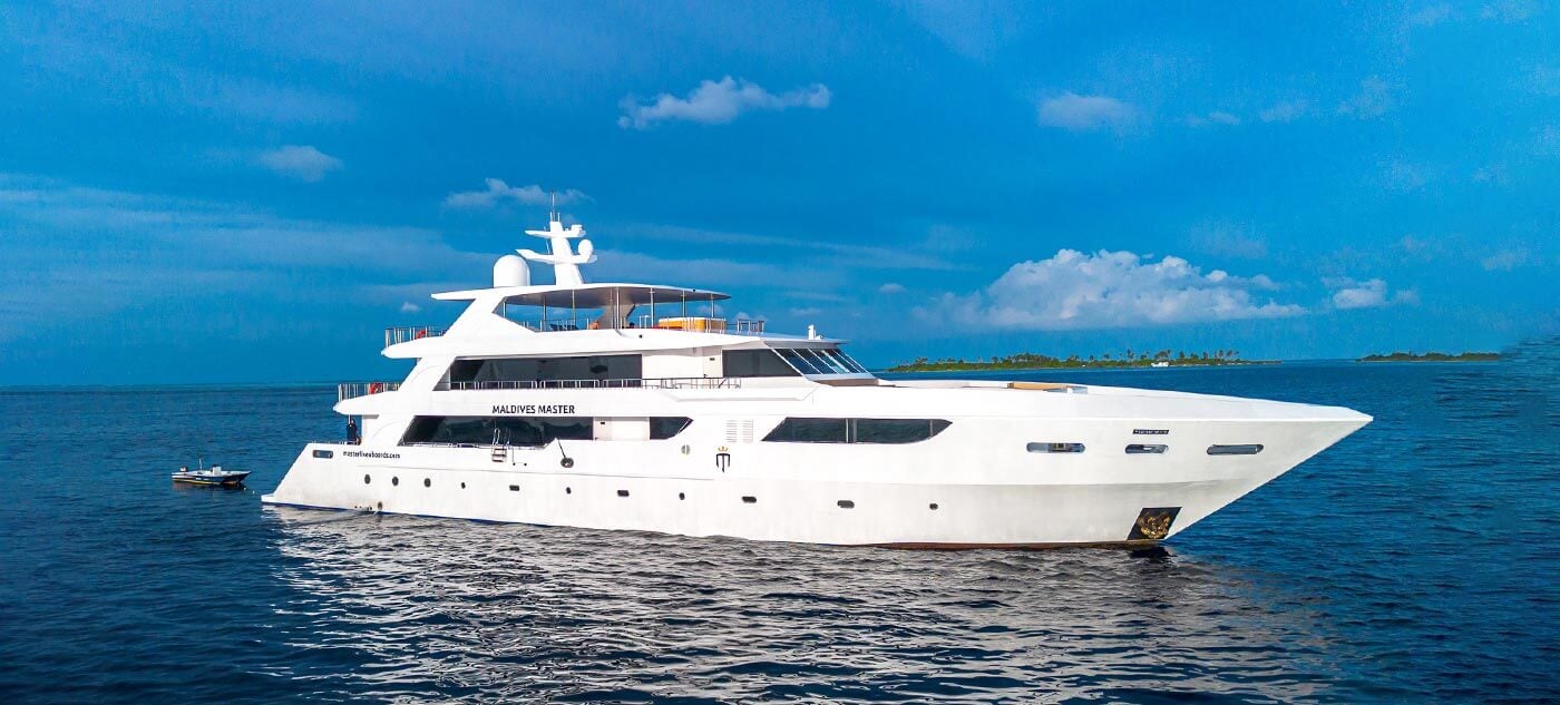 Maldives Master liveaboard features diving at Maaya Thila and Fish Head, with frequent encounters with whale sharks, manta rays, and dense coral gardens across the atolls