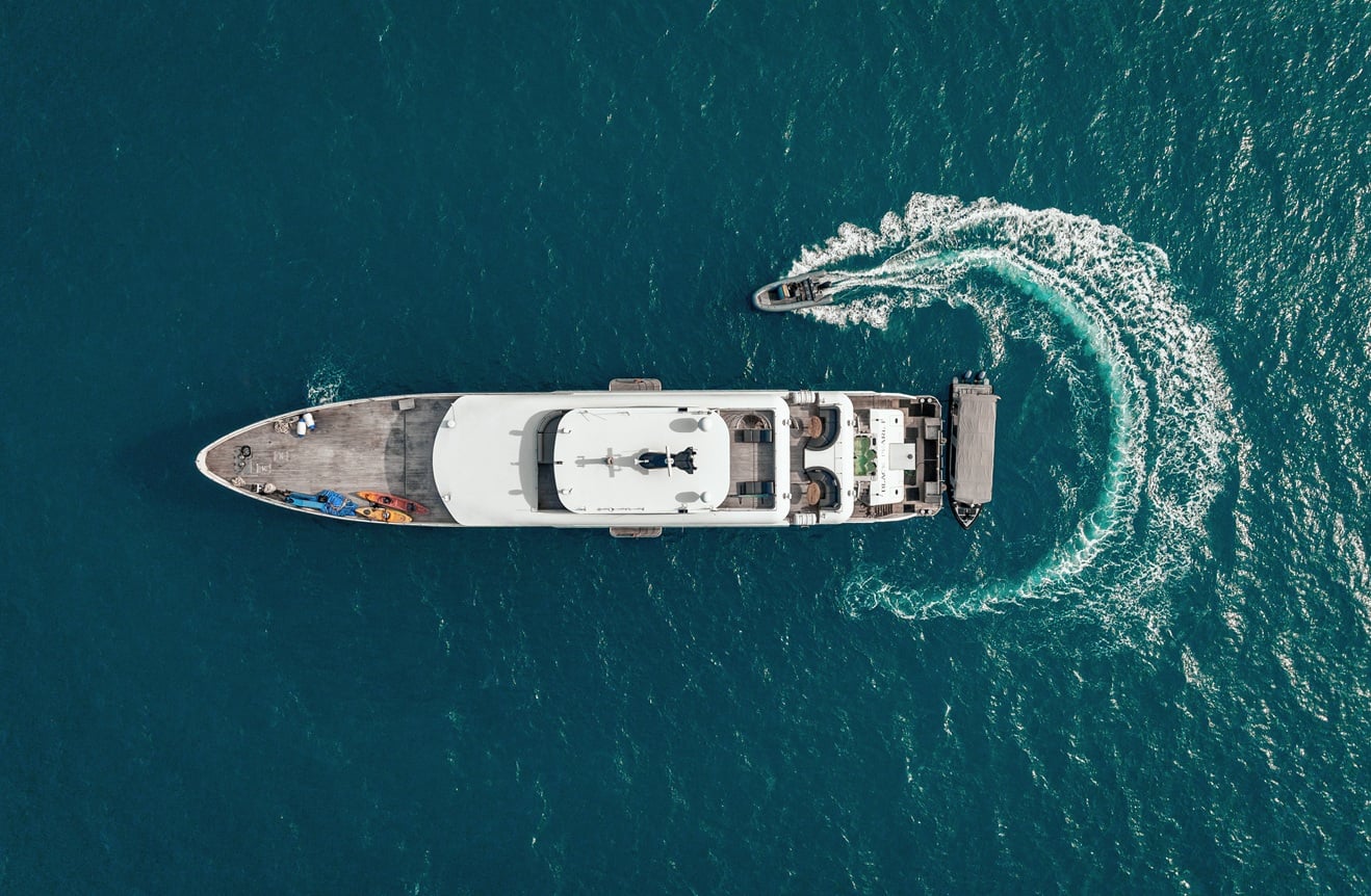 Black Pearl, a 46-meter luxury yacht, cruises Palau's pristine waters, offering divers access to sites like Blue Corner and German Channel, renowned for abundant marine life including sharks and manta rays